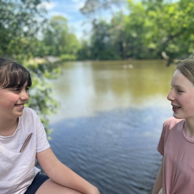 girls by a lake