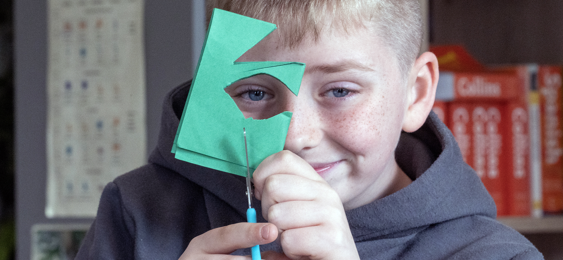 boy cutting paper