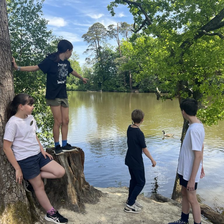 students by the lake