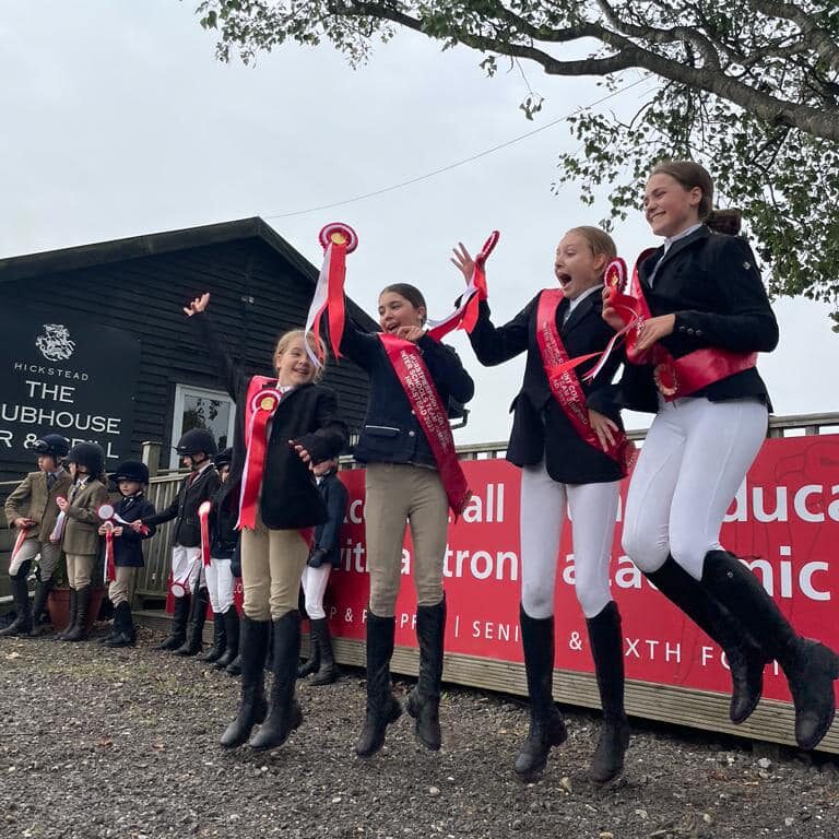 students with rosettes